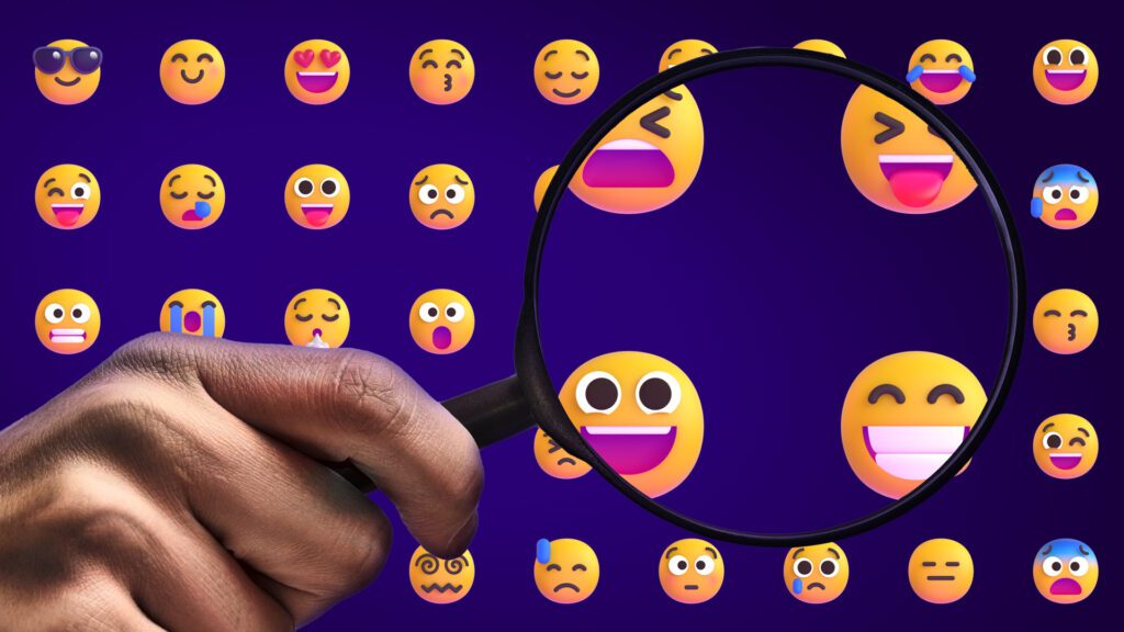 A magnifying glass looking at emojis in detail